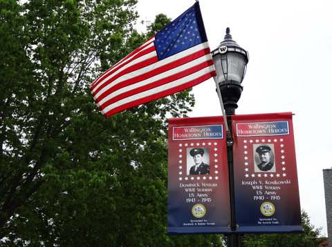 a Wallington hometown heroes banner hangs on a street light