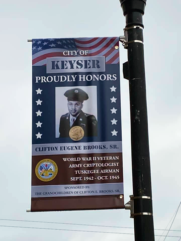 a banner that says city of keyser proudly honors clifton eugene brooks sr.